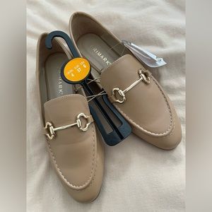 Tan loafers with gold detail